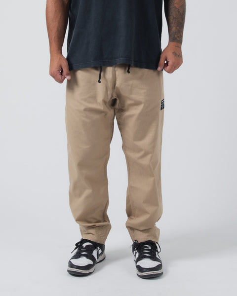 【MATIN KIM】 SHIRRING POINT NYLON PANTS IN KHAKI SHIRRING POINT NYLON PANTS IN KHAKI - MATINKIM
